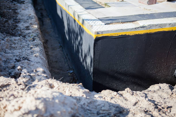 Professional Waterproofing technician working in Star City, IN